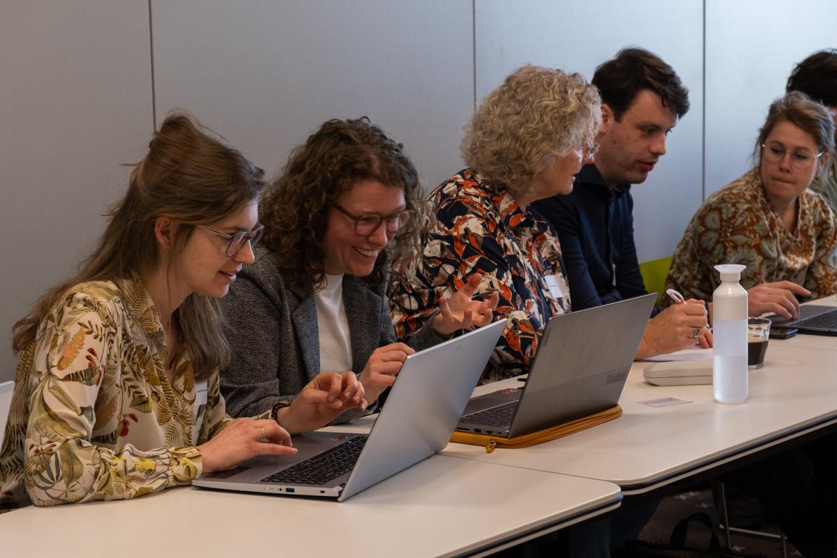 Deelnemers tijdens de GenAI workshop